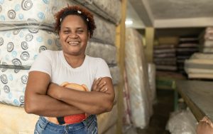 Woman standing in front of mattresses