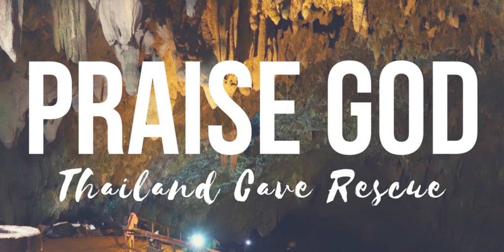 A picture of the cave in Thailand, with the words "Praise God."