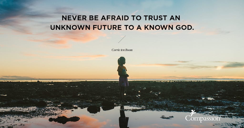 A silhouette of a girl on a beach. Quote on image says: “Never be afraid to trust an unknown future to a known God.” – Corrie ten Boom