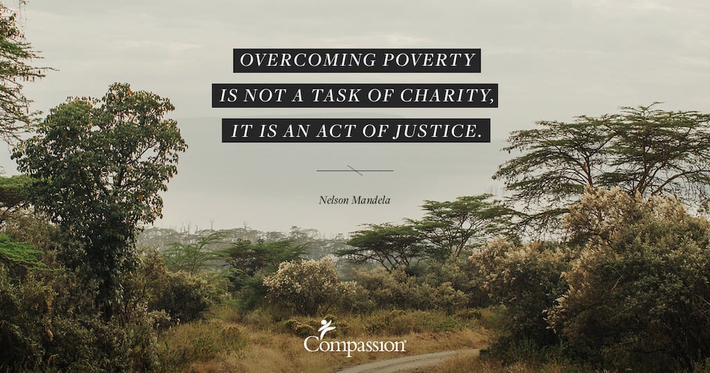 A dry bush landscape. Quote on image says: “Overcoming poverty is not a task of charity, it is an act of justice.” – Nelson Mandela