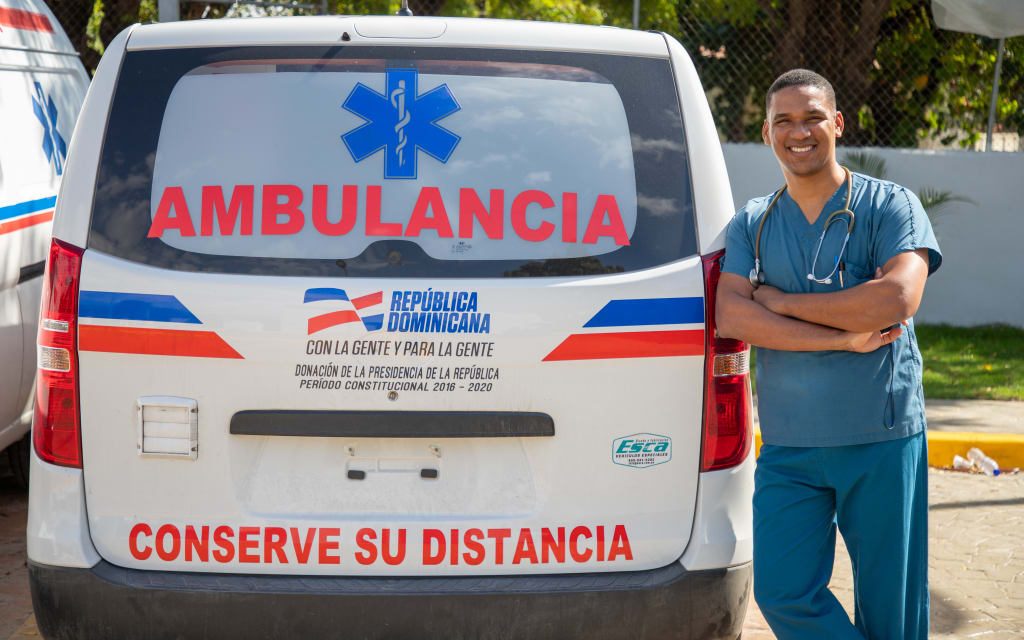 Jose outside of an ambulance truck