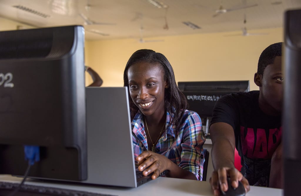 Georgina works at a computer in a computer lab.