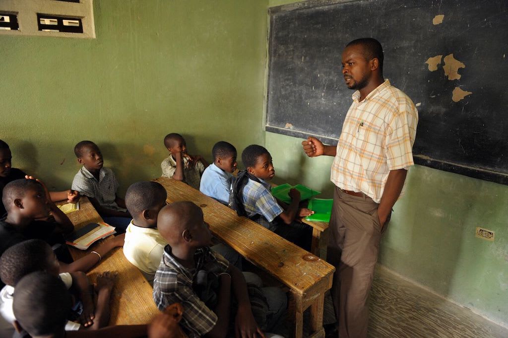 A teacher in a classroom in Haiti.