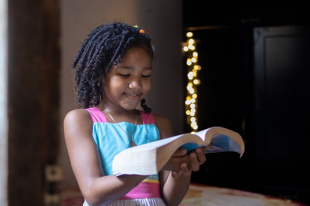 Girl reading Bible
