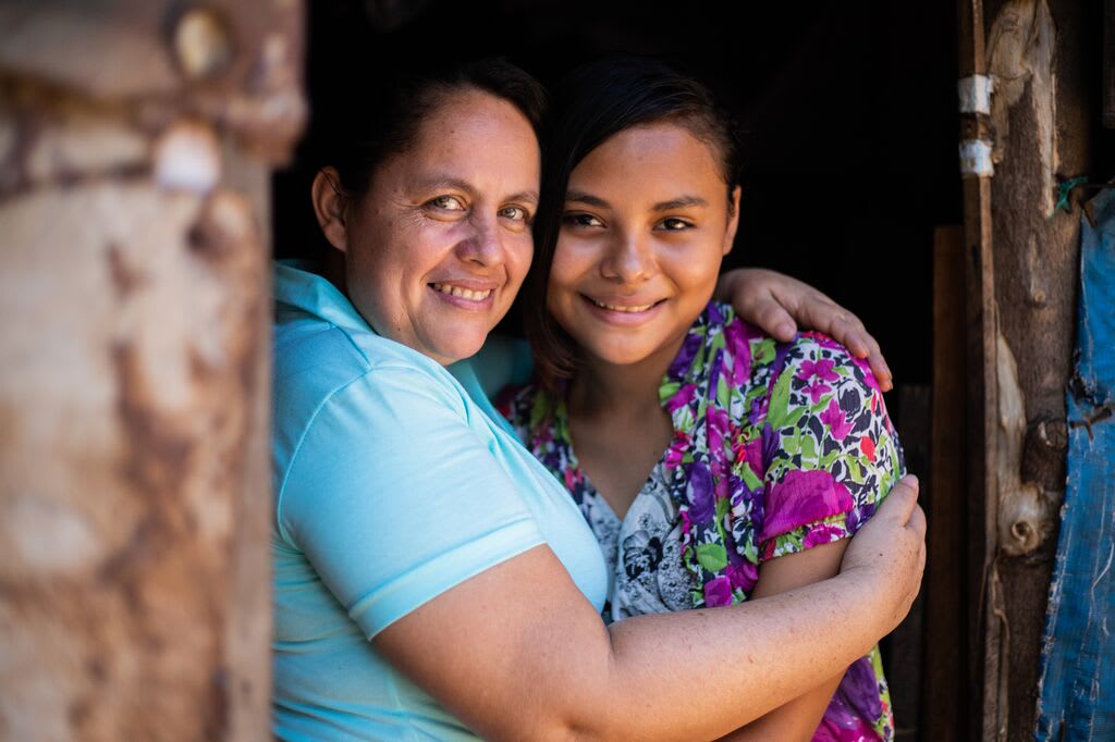 Estrella poses with her Compassion director