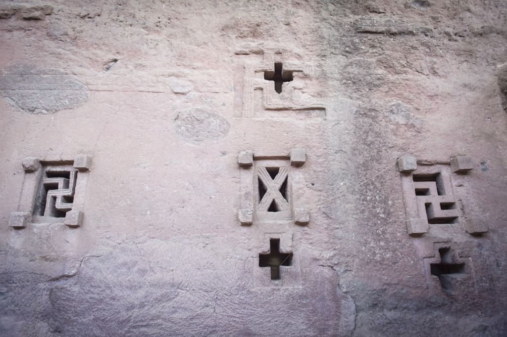 Details on the wall of The Church of Saint George, one of many monolithic rock-cut churches hewn into the rocky hills of Lalibela, Ethiopia.