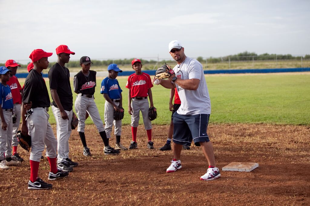 Albert Pujols playing baseball with DR boys
