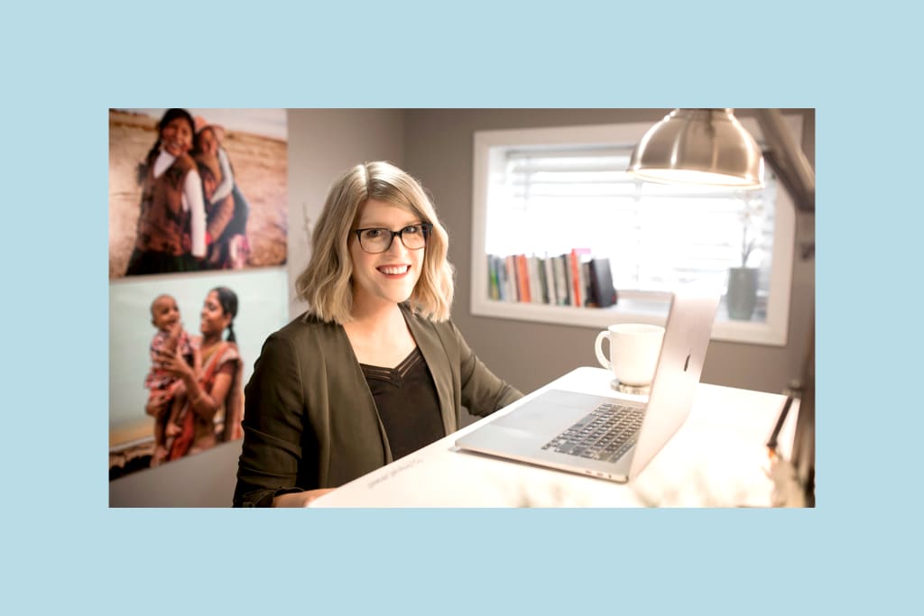 Allison at her desk in her home office.