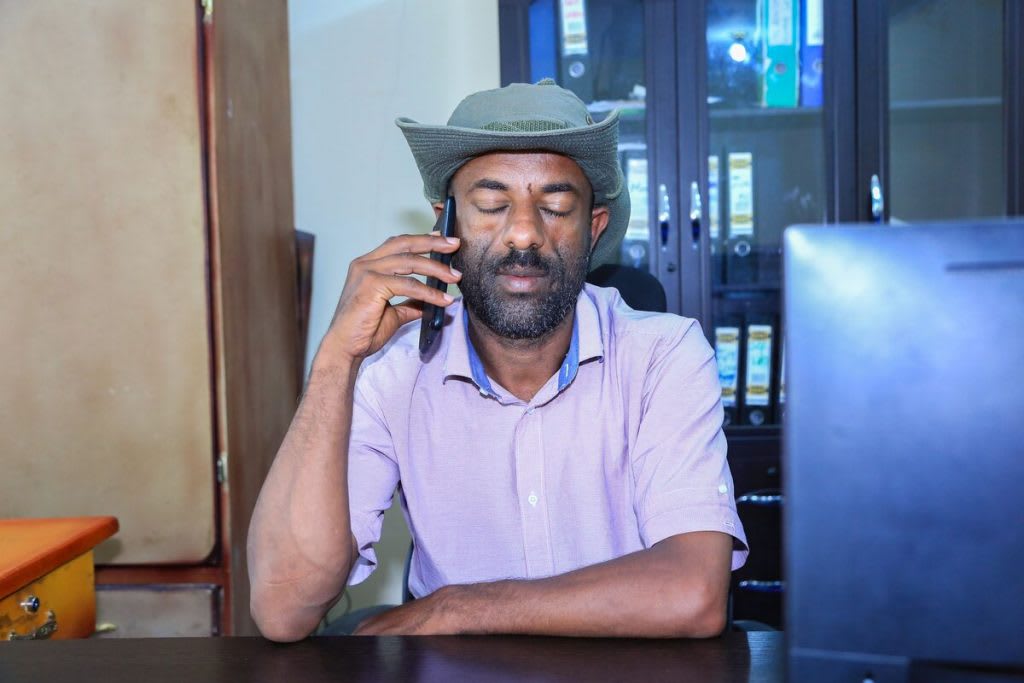 Latarik, local Compassion centre director, prays for struggling children and youth over the phone.