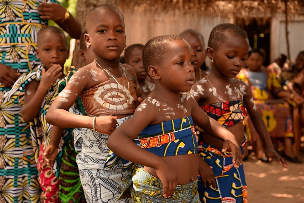 Girls in Togo preparing to do a traditional dance at a Compassion centre.