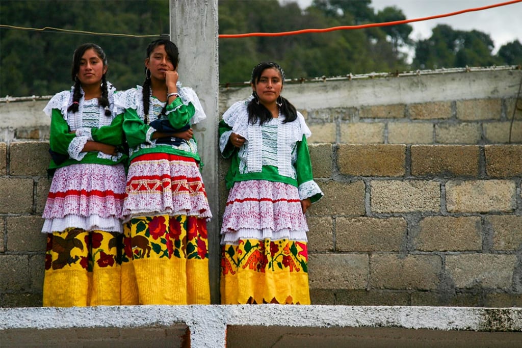 Girls in Mexico wearing traditional dress for a festival
