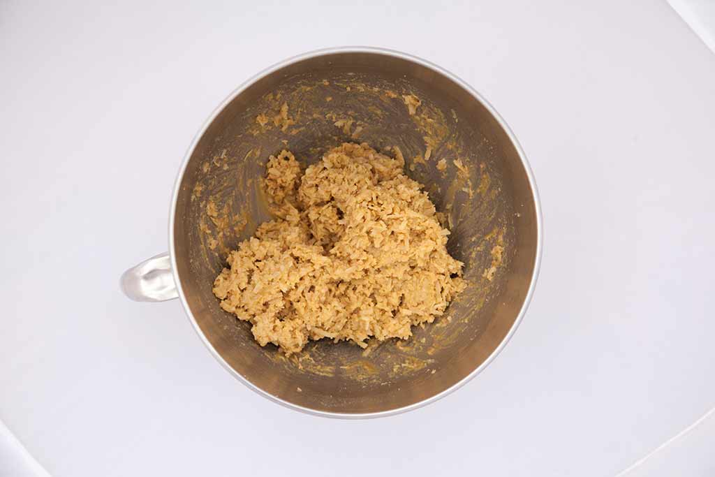 A mixing bowl full of cookie dough.