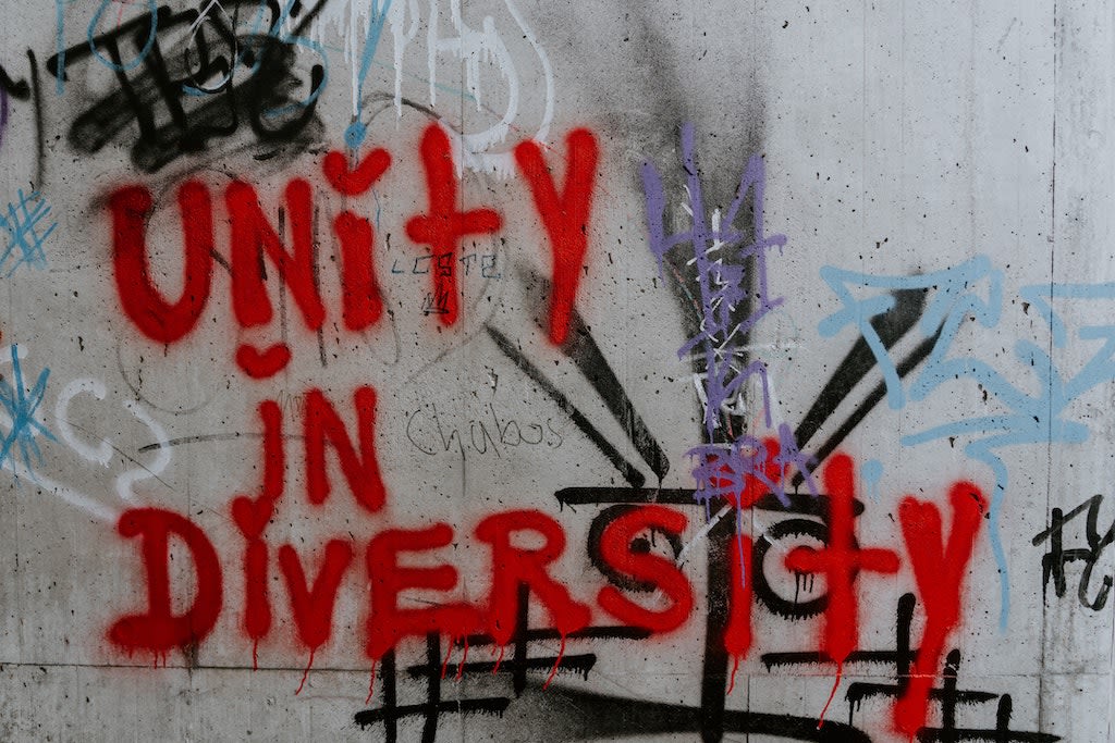 Graffiti that reads "unity in diversity"