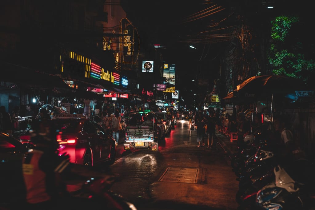 A busy street at night.