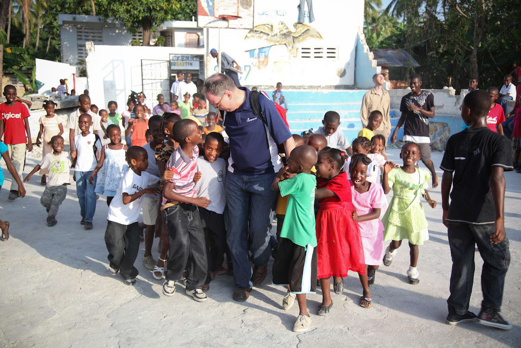 Barry walking amongst a group of children in one of Compassion's field countries.