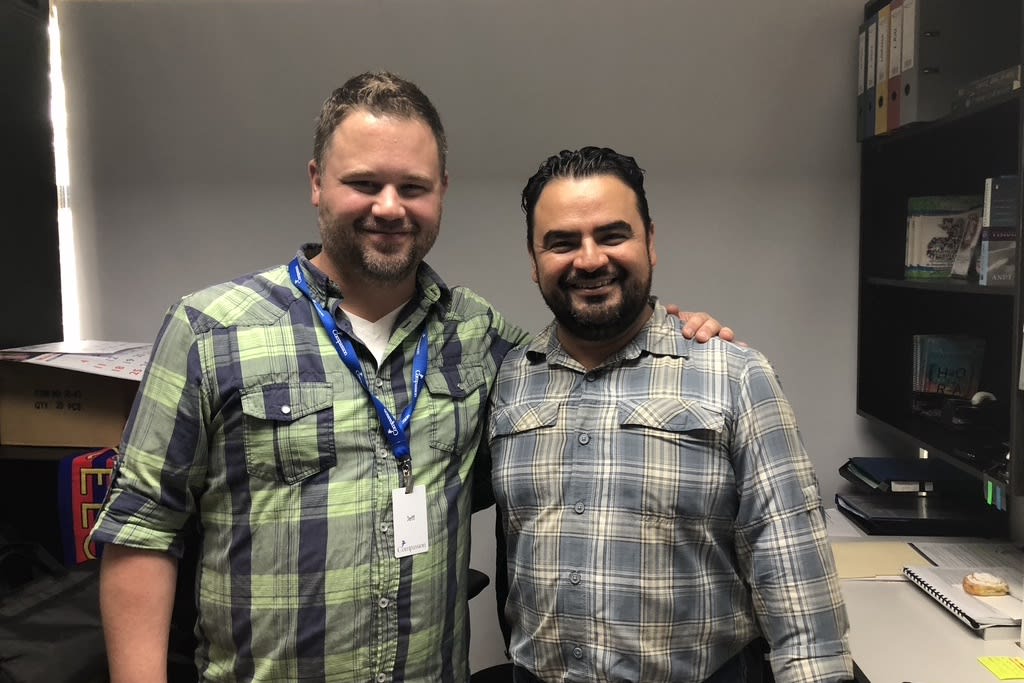 Jeff with the National Director of Compassion Guatemala. Both are wearing plaid shirts and have their arms on each other's shoulders.