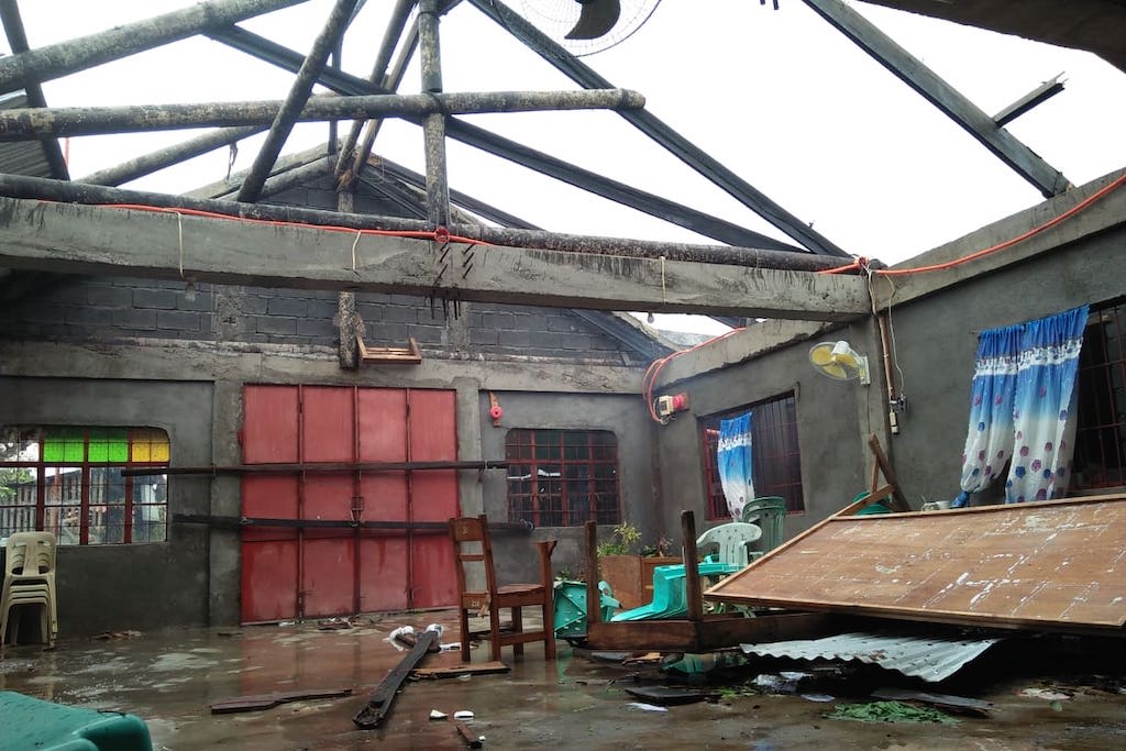 A church building's interior, after the roof had been blown off by the storm.