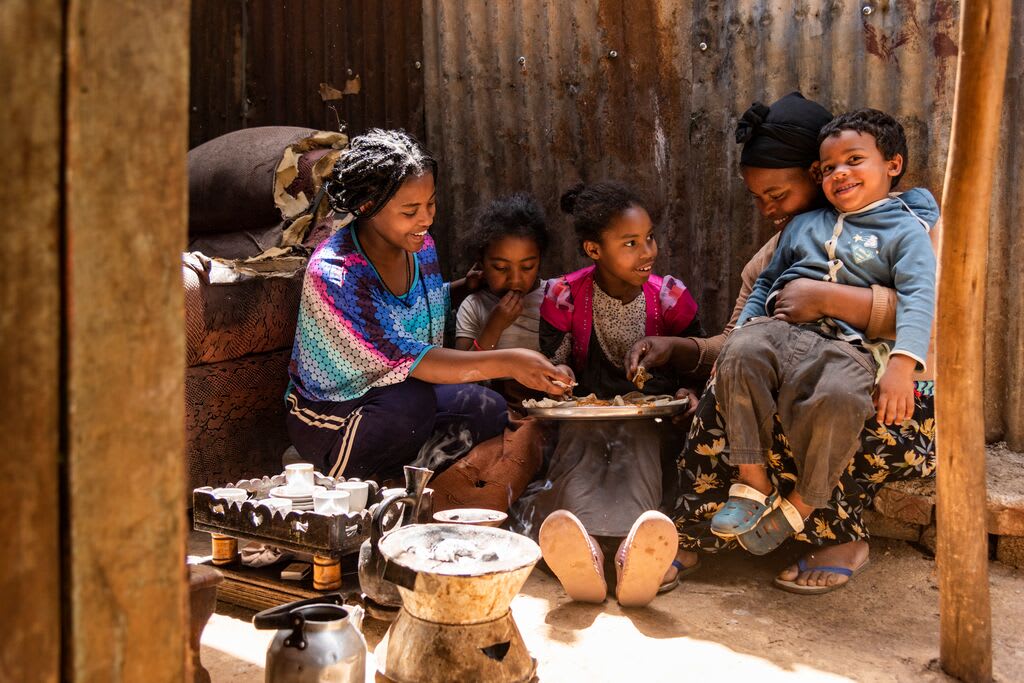 Abiyot's family eats food altogether from the money they received from Compassion.