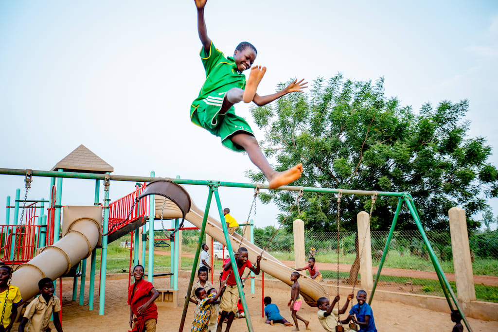 Children playing on a playground in Togo.