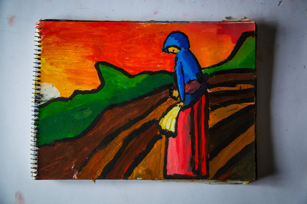 One of Hector's paintings, of a woman standing in an agriculture field.