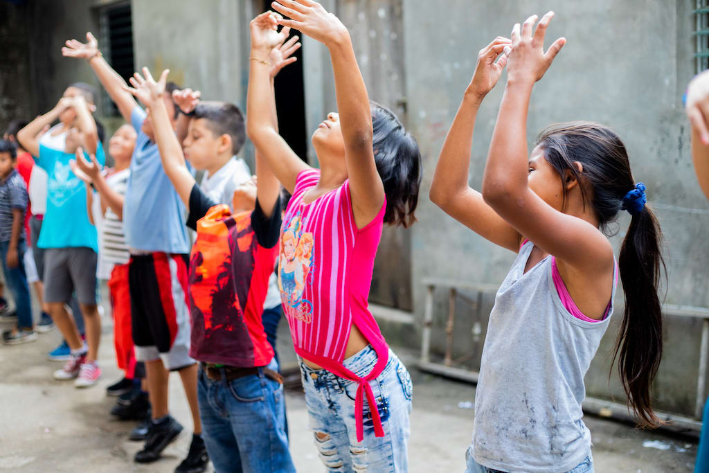 A group of Nicaraguan children doing stretches.