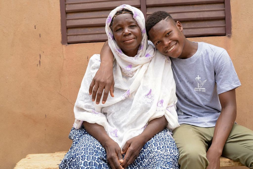 Abdoul poses with his grandmother, Alimata.