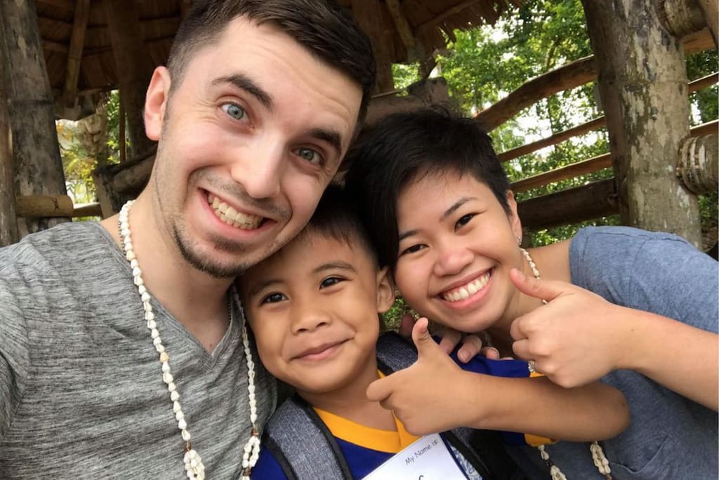 Timothy, Abigail and their sponsored child James take a selfie.