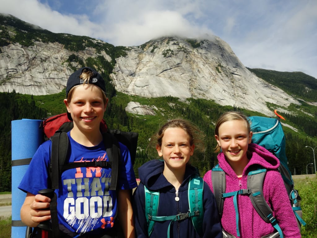 The Hennesey siblings hiking in the mountains—just one of their many family activities. Elias (left), Amadeus (middle) and Eowyn (right).
