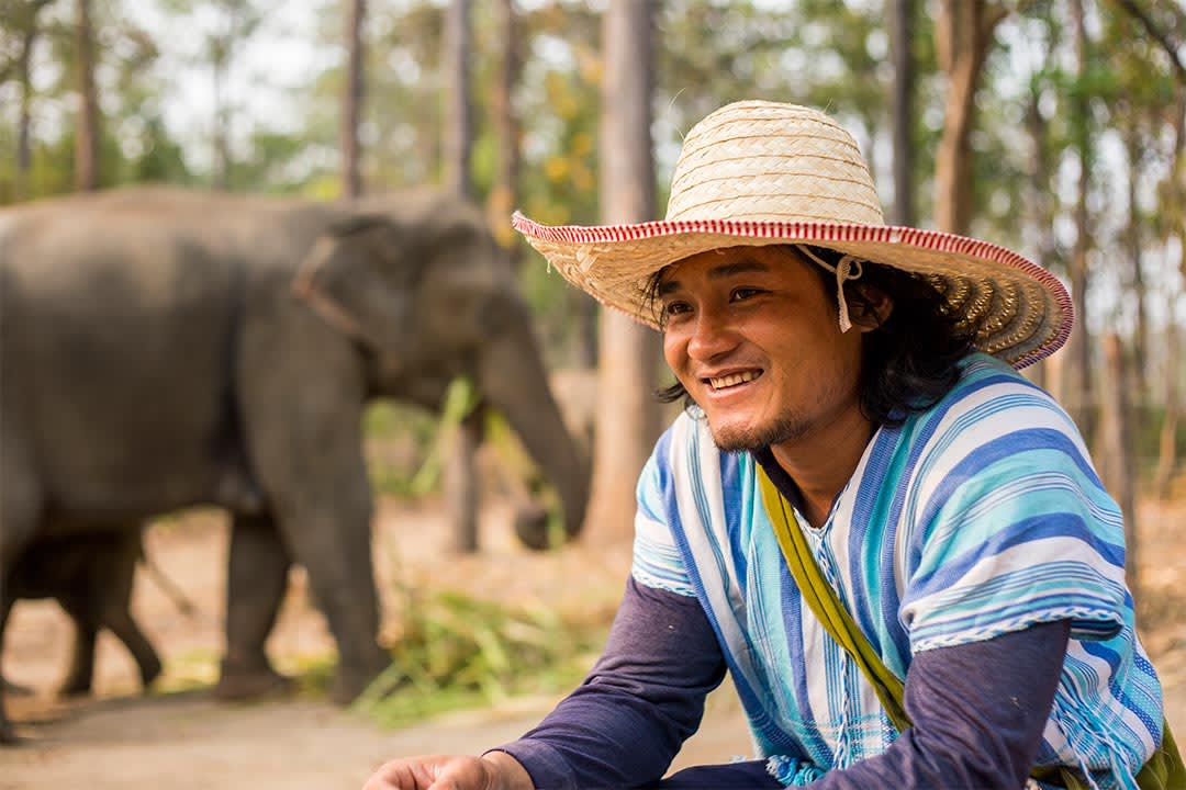 A Compassion graduate in Thailand who cares for elephants.
