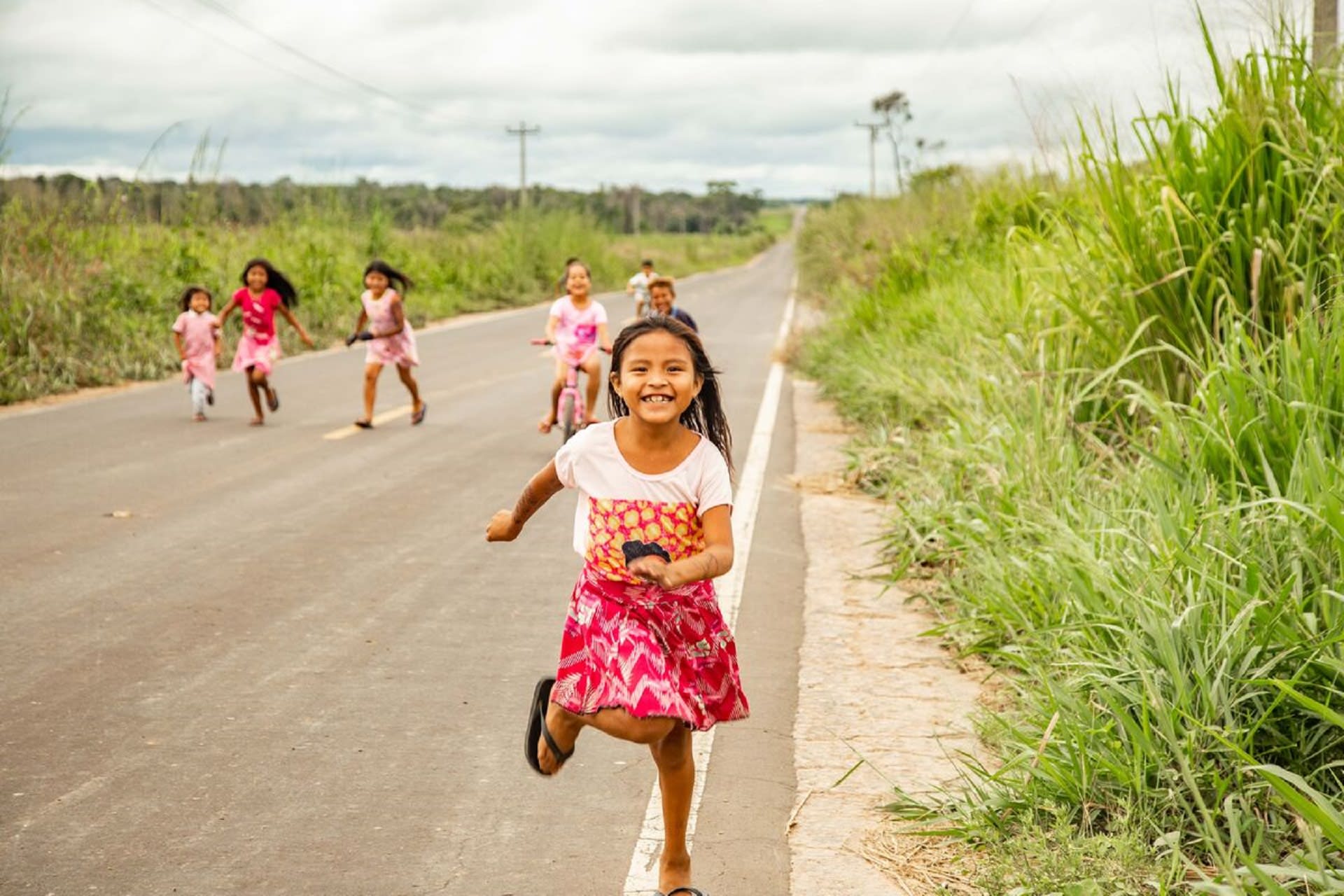 A little girl running toward the camera