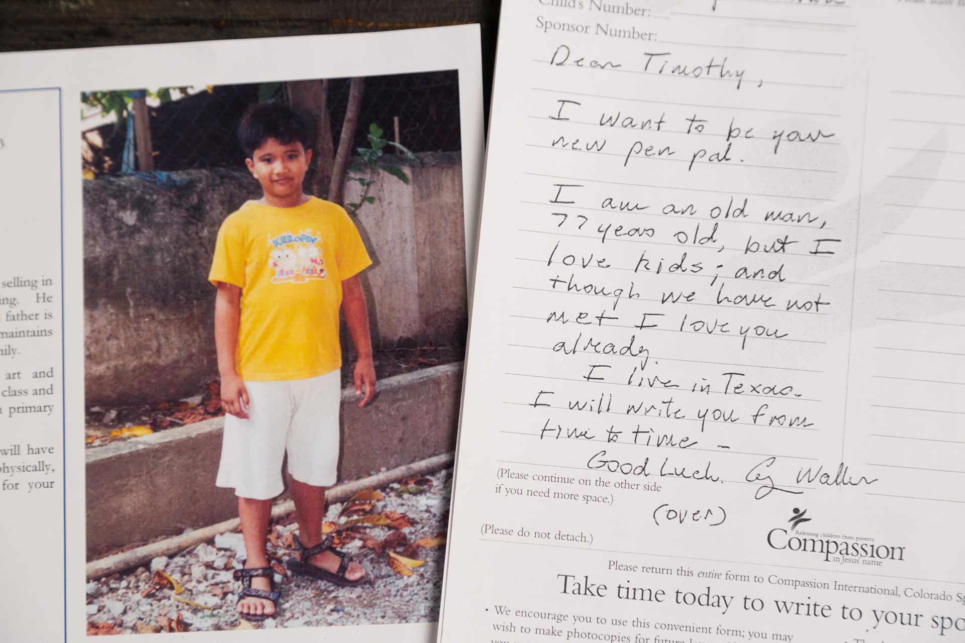 A picture of a boy in a yellow shirt next to a letter signed George Walker