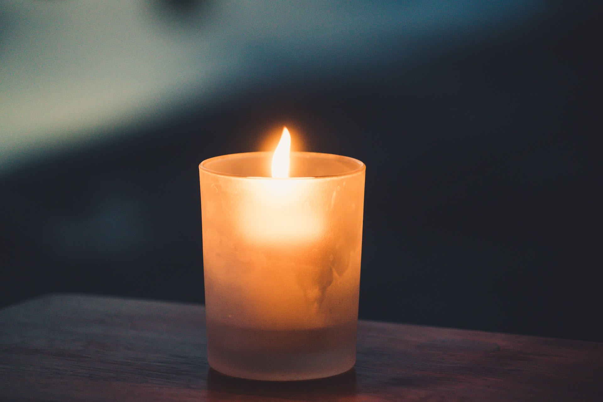 A candle on a table.
