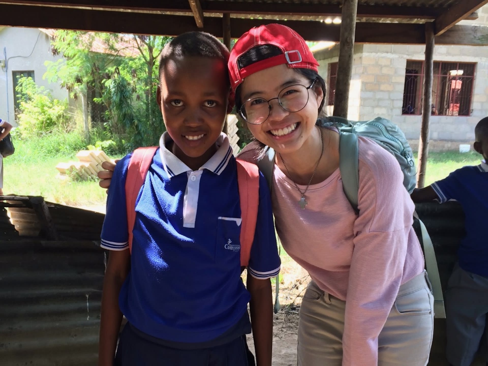 Alyssa with her sponsored child, Happyness, in Tanzania.