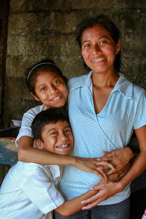 Silvia, a mom in Guatemala, with her two children, a girl and a boy.